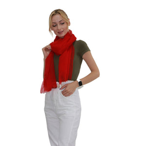 one woman with featherlight red scarf