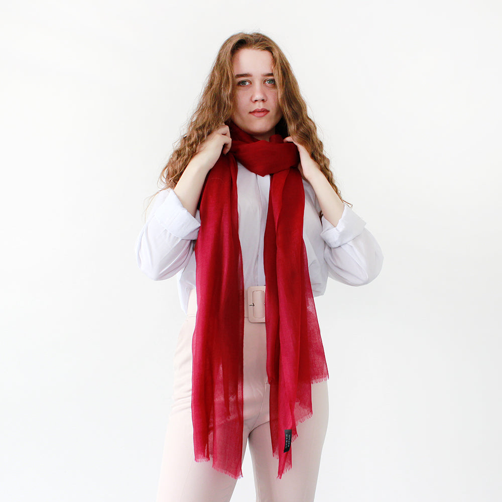 a happy girl with red featherlight shawl