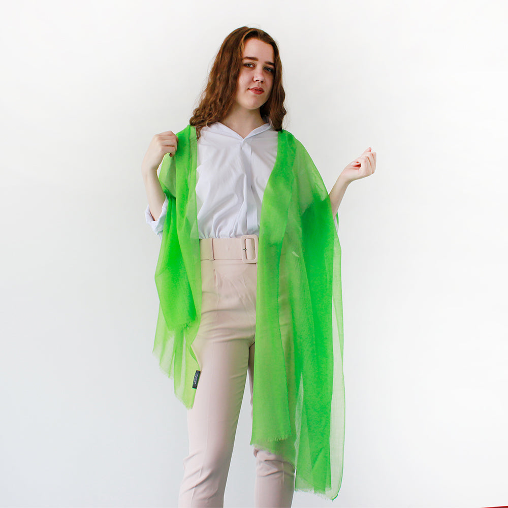 a happy girl with green onion color scarf